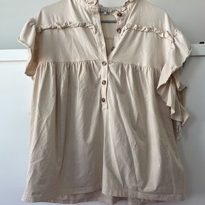 Neutral ruffle top